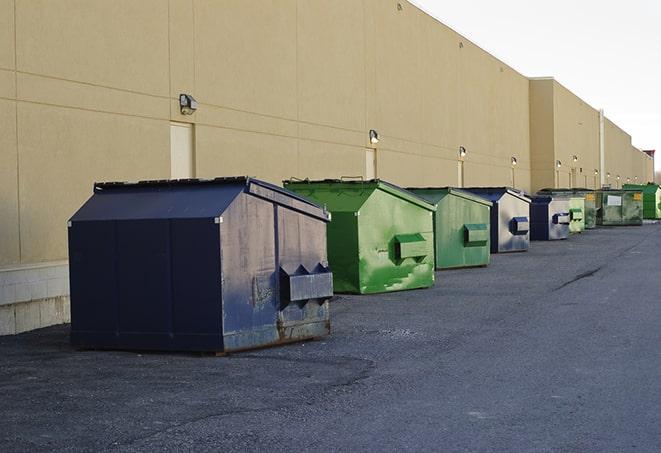 a group of dumpsters lined up along the street ready for use in a large-scale construction project in Chatsworth, CA